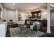 Finished basement boasts a cozy living area with a wet bar, contemporary furnishings, and stylish lighting fixtures at 1894 Rhettsbury St, Carmel, IN 46032