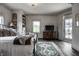 Cozy bedroom with a wrought iron bed frame, a patterned rug, and built-in bookshelves at 1894 Rhettsbury St, Carmel, IN 46032