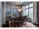 Formal dining room with exquisite chandelier and a beautiful wall mural at 1894 Rhettsbury St, Carmel, IN 46032