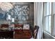 Elegant dining room with a chandelier, wood table, and beautiful wall art at 1894 Rhettsbury St, Carmel, IN 46032