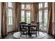 Elegant dining room featuring a chandelier and large windows at 1894 Rhettsbury St, Carmel, IN 46032