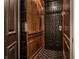Unique elevator featuring black and wood details and elegant carpet at 1894 Rhettsbury St, Carmel, IN 46032