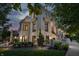 A luxurious home boasts manicured gardens and a charming outdoor design at 1894 Rhettsbury St, Carmel, IN 46032