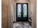 Grand foyer featuring patterned marble floors and a large glass-paneled front door at 1894 Rhettsbury St, Carmel, IN 46032
