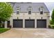 Detached three-car garage with complementary architecture offering ample parking and curb appeal at 1894 Rhettsbury St, Carmel, IN 46032
