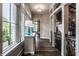 Hallway with hardwood floors, natural light, and a view into other rooms at 1894 Rhettsbury St, Carmel, IN 46032