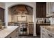 Gourmet kitchen featuring a Wolf range and stainless steel hood at 1894 Rhettsbury St, Carmel, IN 46032