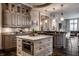 Kitchen with a central island, custom cabinetry and granite countertops at 1894 Rhettsbury St, Carmel, IN 46032