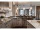 Modern kitchen featuring custom wood cabinetry and granite countertops at 1894 Rhettsbury St, Carmel, IN 46032