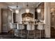 Kitchen island with bar stool seating and pendant lighting at 1894 Rhettsbury St, Carmel, IN 46032