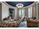 Inviting living room with leather sofas, custom lighting, and elegant decor at 1894 Rhettsbury St, Carmel, IN 46032