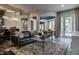 Basement living room with sleek black leather sofa, a wet bar, stylish decor, and an open layout at 1894 Rhettsbury St, Carmel, IN 46032