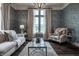 Cozy living room with stylish furniture and a beautiful chandelier at 1894 Rhettsbury St, Carmel, IN 46032