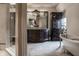 Elegant bathroom featuring a marble floor, chandelier, and clawfoot tub at 1894 Rhettsbury St, Carmel, IN 46032