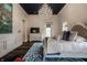 Spacious main bedroom with a decorative chandelier and elegant white dresser with television at 1894 Rhettsbury St, Carmel, IN 46032