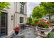 Charming outdoor patio with seating, lush landscaping, and courtyard views at 1894 Rhettsbury St, Carmel, IN 46032