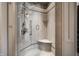 Luxurious walk-in shower with a bench and unique fixtures at 1894 Rhettsbury St, Carmel, IN 46032