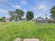Backyard with tall grass and a shed in need of repair at 1947 N Parker Ave, Indianapolis, IN 46218