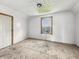 Bedroom featuring bright, neutral walls, a window, and carpeted floor, awaiting personalization at 1947 N Parker Ave, Indianapolis, IN 46218