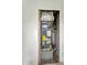 The image focuses on a furnace, highlighting its features and placement within the home's utility setup at 1947 N Parker Ave, Indianapolis, IN 46218