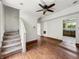 The room features carpeted stairs, hardwood floors, and white walls leading to additional parts of the home at 1947 N Parker Ave, Indianapolis, IN 46218