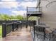 Spacious back deck with gray grill, a small upper deck, and wooden railing at 2222 Pleasant St, Indianapolis, IN 46203