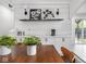 Bar area with stylish tile backsplash, shelving, and modern appliances at 2222 Pleasant St, Indianapolis, IN 46203