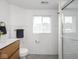 Modern bathroom featuring a tiled wall, and wood vanity at 2222 Pleasant St, Indianapolis, IN 46203