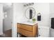 Modern bathroom featuring a round mirror, vanity, and toilet at 2222 Pleasant St, Indianapolis, IN 46203