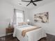 Cozy bedroom with wood floors, soft lighting, and a comfortable bed dressed in white linens at 2222 Pleasant St, Indianapolis, IN 46203