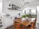 Dining area featuring a bar, white backsplash, and a view to the kitchen at 2222 Pleasant St, Indianapolis, IN 46203