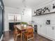 Dining room with elegant lighting, a bar area, and barn door access at 2222 Pleasant St, Indianapolis, IN 46203