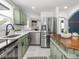 Bright kitchen with modern, stainless steel appliances and sleek countertops at 2222 Pleasant St, Indianapolis, IN 46203