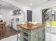 Kitchen island features wooden top and lower storage with modern cabinetry at 2222 Pleasant St, Indianapolis, IN 46203