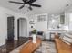 Inviting living room with an open layout to the kitchen and hardwood floors throughout at 2222 Pleasant St, Indianapolis, IN 46203