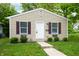 Inviting single-story home with shutters, garden boxes, and tidy landscaping at 2402 Adams St, Indianapolis, IN 46218