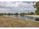 Backyard with private dock and serene lake view under a cloudy sky at 28 Patriot Ct, Greenfield, IN 46140