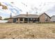 The backyard showcasing the expansive layout of the house and backyard at 28 Patriot Ct, Greenfield, IN 46140