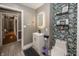 Stylish bathroom featuring a modern vanity, decorative wallpaper, and contemporary fixtures for a fresh, updated look at 28 Patriot Ct, Greenfield, IN 46140