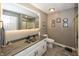 Updated bathroom with modern lighting, gray-toned walls, elegant vanity, and a tiled floor at 28 Patriot Ct, Greenfield, IN 46140