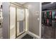 Modern bathroom featuring a glass-enclosed shower, an organized walk-in closet, and contemporary finishes for added convenience at 28 Patriot Ct, Greenfield, IN 46140