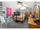 Bright bedroom featuring plush carpet, neutral walls, arched window, and ceiling fan at 28 Patriot Ct, Greenfield, IN 46140