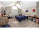 Cozy bedroom with neutral walls, carpet flooring, and a window allowing natural light at 28 Patriot Ct, Greenfield, IN 46140
