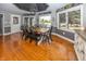 Sunlit dining area features water views, modern lighting and wood flooring at 28 Patriot Ct, Greenfield, IN 46140