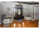 Well-lit Foyer featuring hardwood flooring and decorations at 28 Patriot Ct, Greenfield, IN 46140