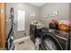 Well-equipped laundry room with modern washer and dryer, storage, and organized space for efficient chores at 28 Patriot Ct, Greenfield, IN 46140