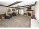 Comfortable living room featuring plush seating, a brick fireplace, and neutral tones at 28 Patriot Ct, Greenfield, IN 46140