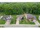 High angle aerial shot of a home with mature trees in a well-established residential neighborhood at 2875 Prairie Stream Way, Columbus, IN 47203