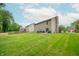 Expansive backyard with green lawn and ample space for recreation and relaxation at 2875 Prairie Stream Way, Columbus, IN 47203