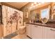 Neutral toned bathroom with decorative accents, featuring a shower with curtain and vanity at 2875 Prairie Stream Way, Columbus, IN 47203